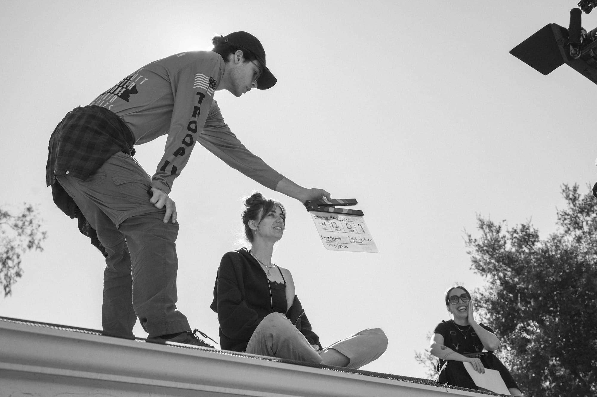 Director on rooftop with monitor